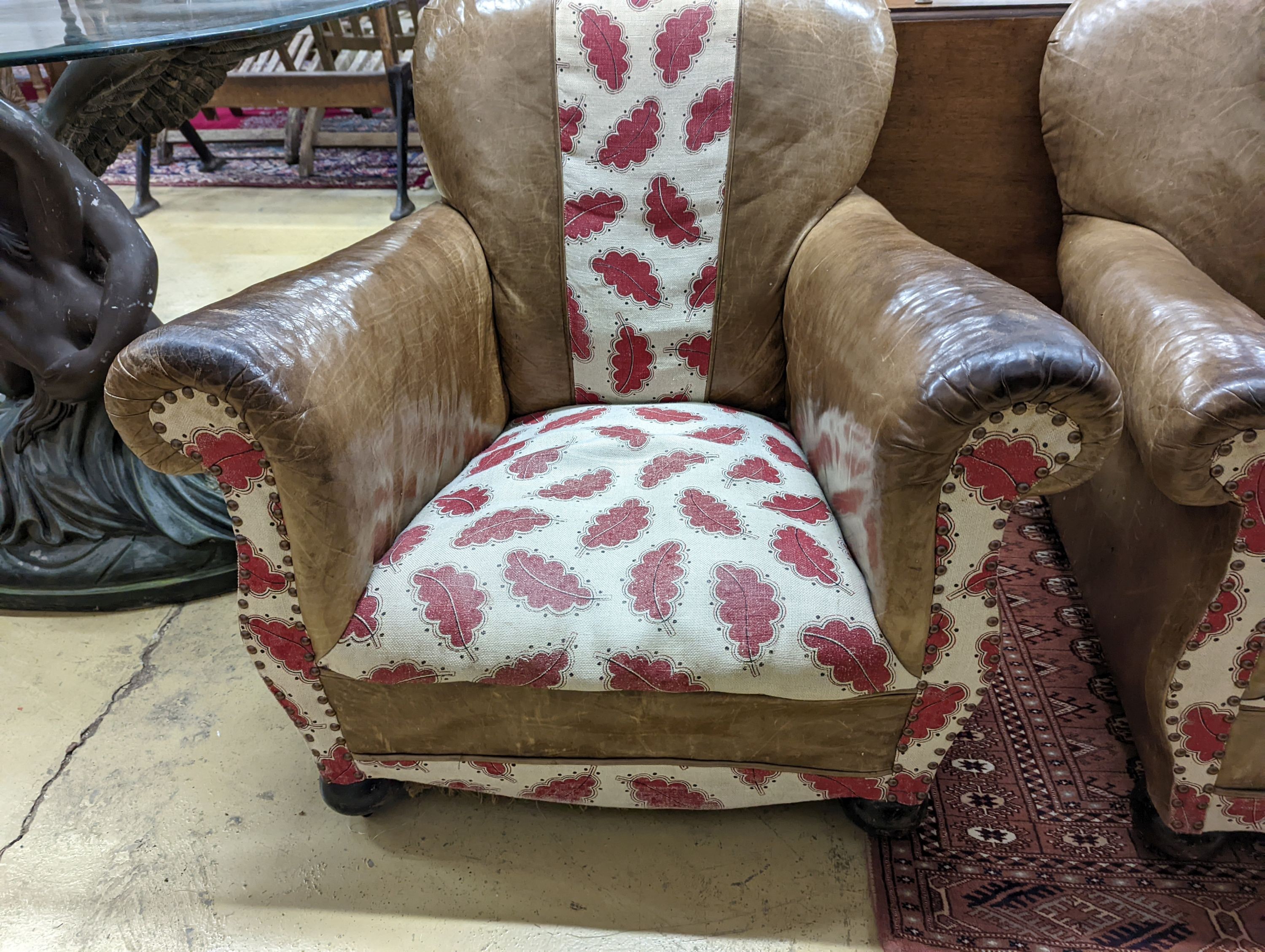 A pair of leather and fabric club armchairs. H-80cm.